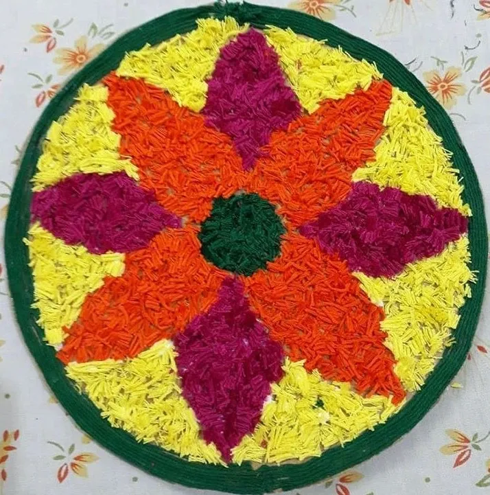 Bright floral pookolam with star flower design Wallpaper
