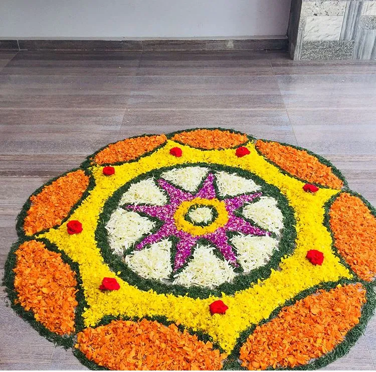 Bright Onam Athapookolam with star burst and floral petals