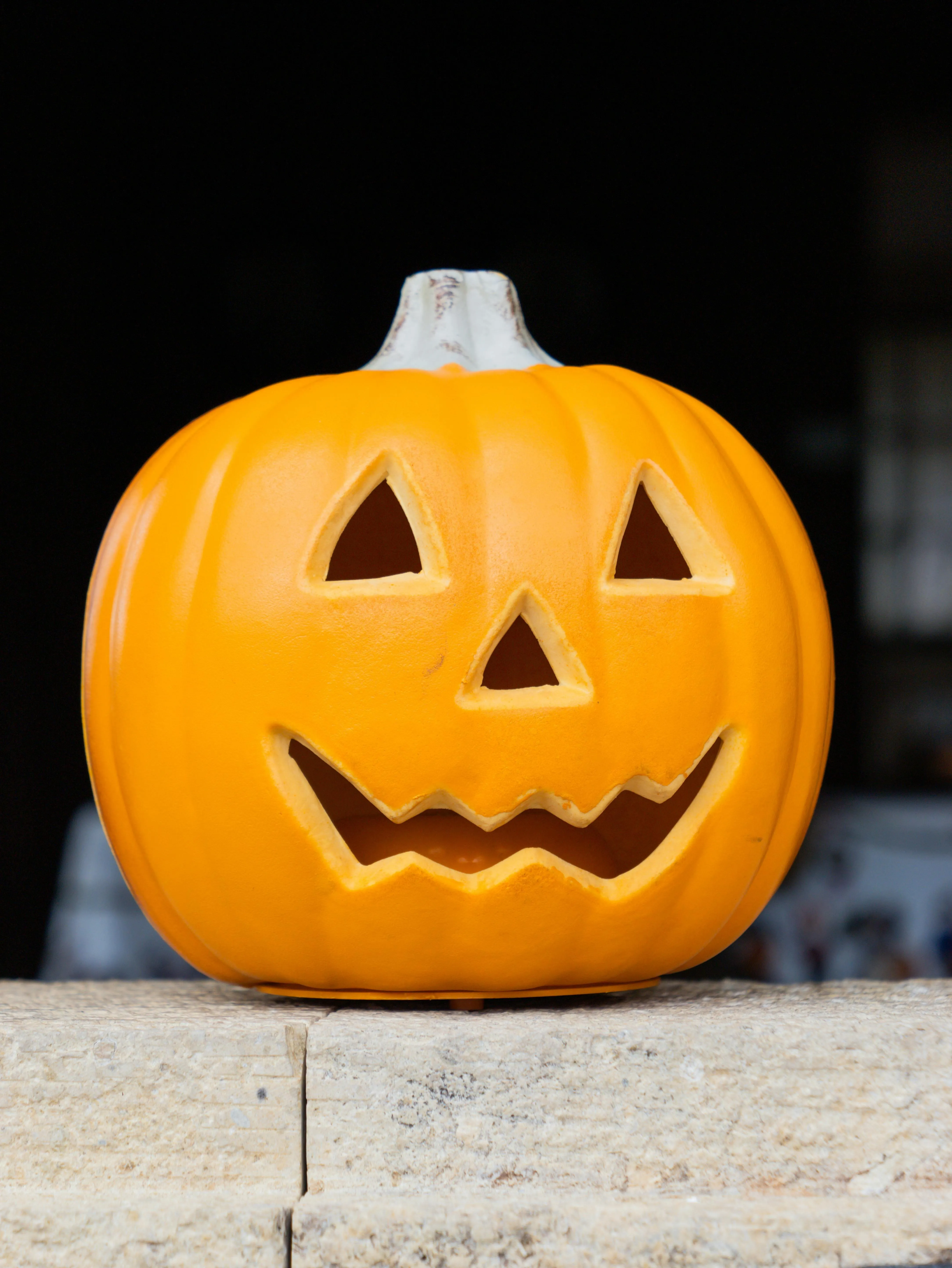 Bright Yellow Pumpkin with Smiling Face Carving Wallpaper
