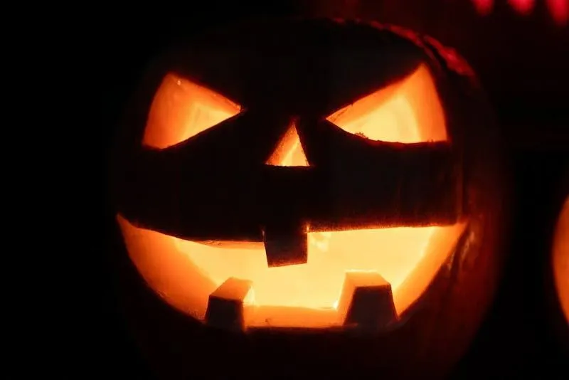 Brightly Lit Pumpkin Carving Glowing in The Dark Wallpaper