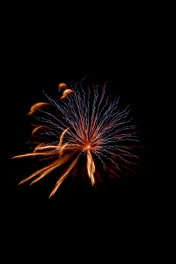 Brilliant Firework Trails Illuminating the Dark Sky Wallpaper