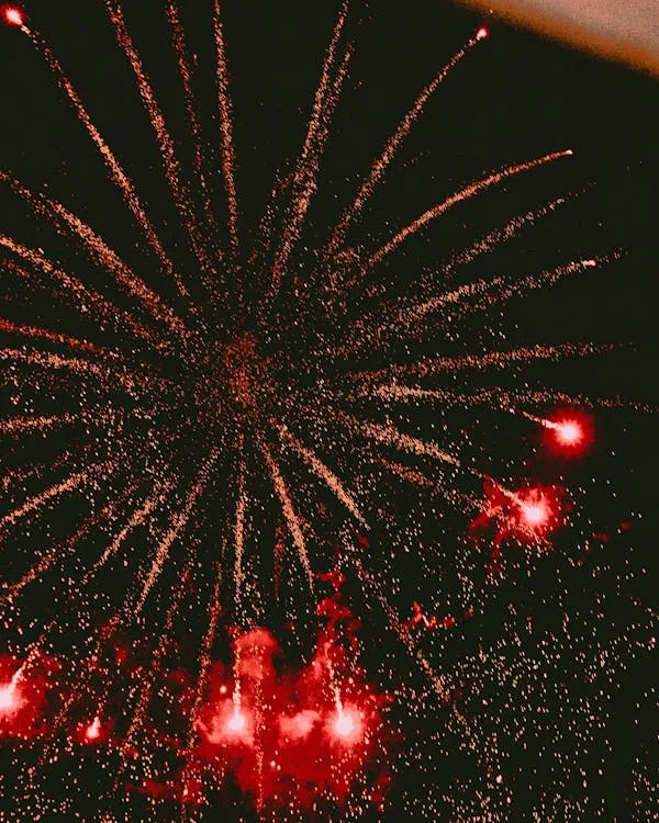 Brilliant fireworks in a burst of red and gold colors