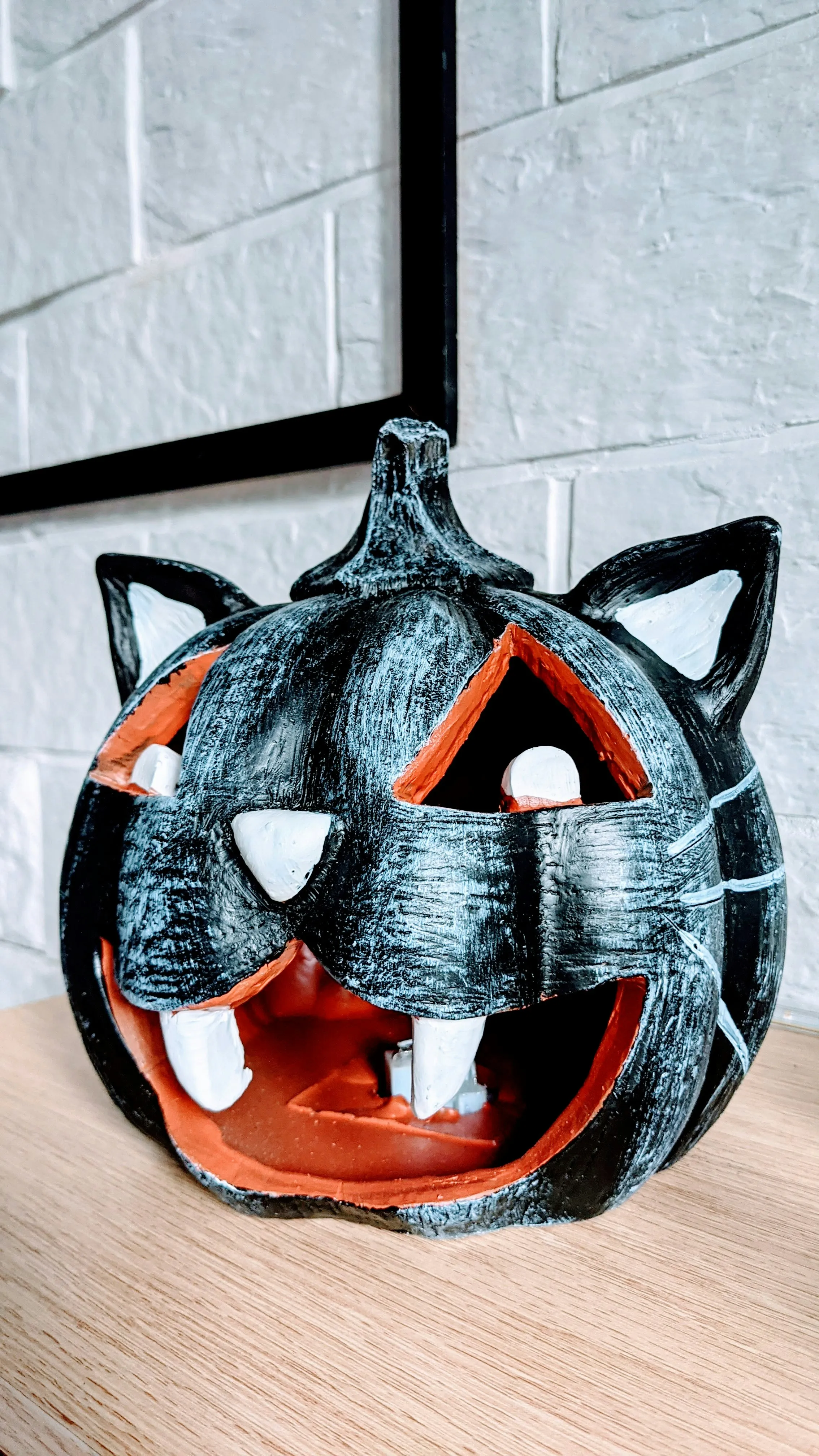 Cat Shaped Craved Pumpkin Lantern on Indoor Table Wallpaper