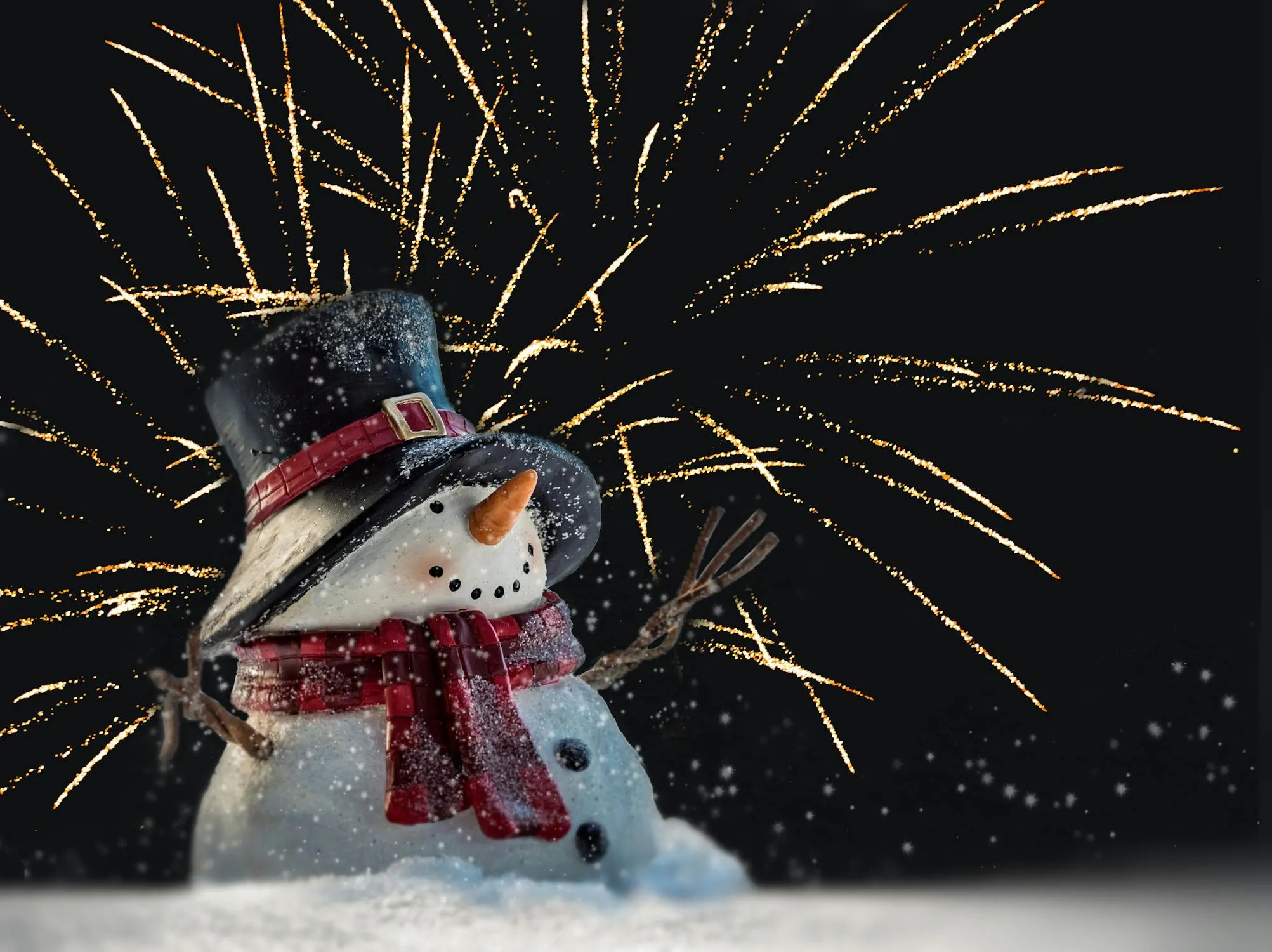 Celebration with snowman and colorful fireworks display