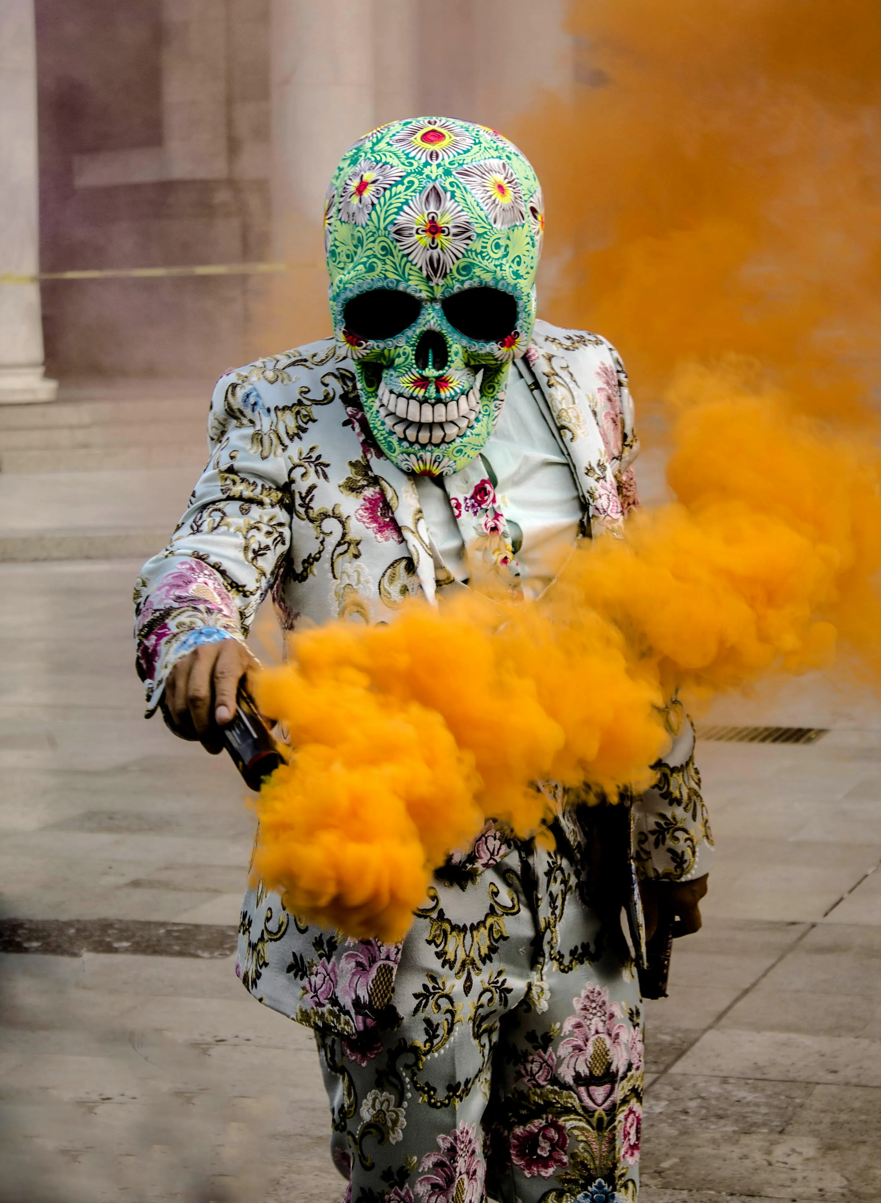Child Wearing Skeleton Costume with Orange Smoke Bomb