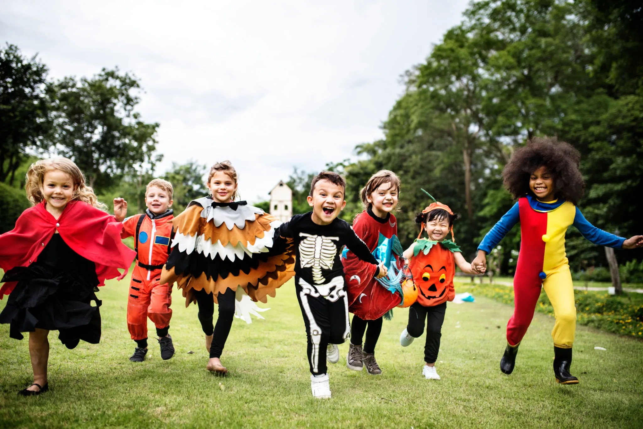 Children Dressed for Halloween Parade in Open Park
