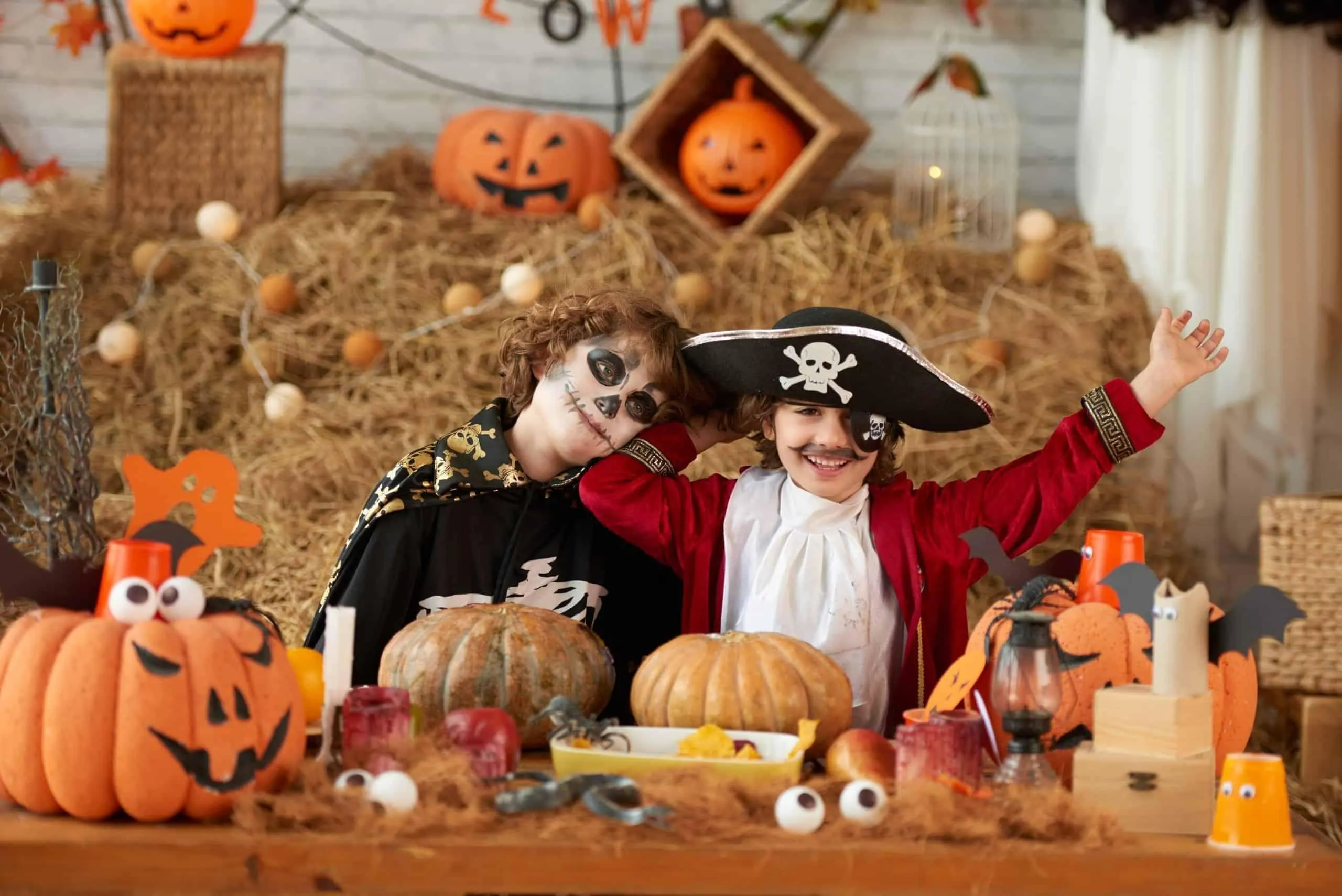 Children in Costumes Playing with Pumpkins at Festival