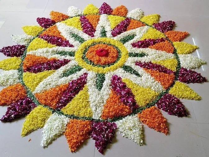 Circular colourful pookolam with triangle shape petal design