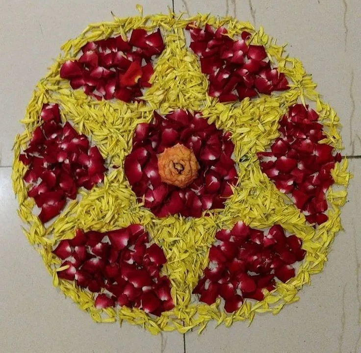 Circular design Athapookolam with star section pattern image