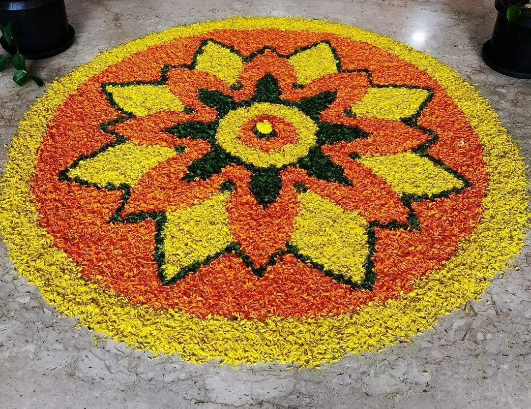 Circular floral design pookolam with bold floral pattern