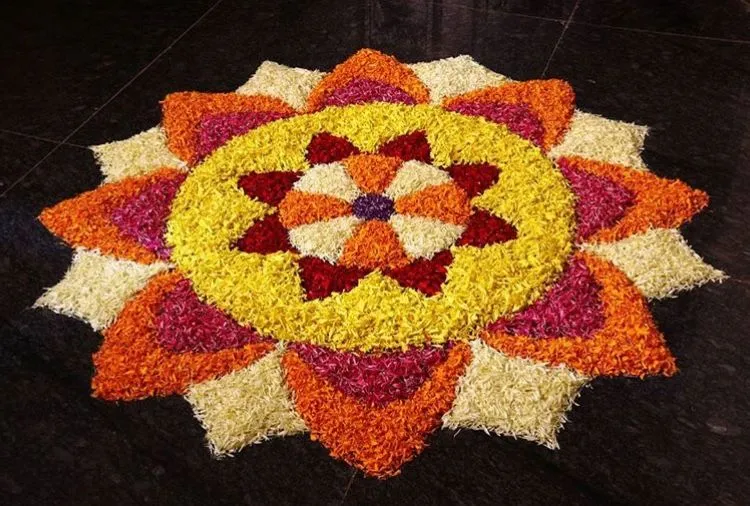 Circular flower Athapookolam with layered petals wallpaper