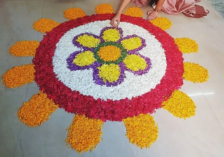 Circular flower center pookolam with petal design Wallpaper