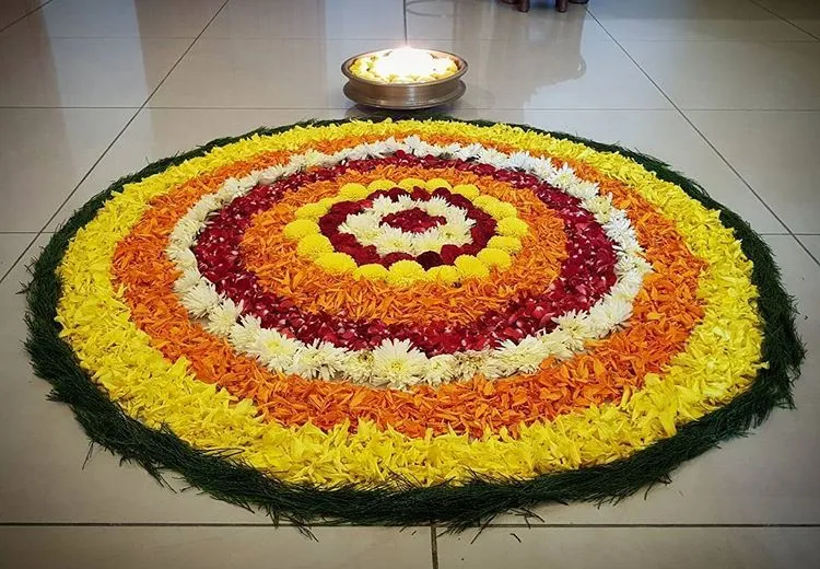 Circular Pookalam Design with bright flower rings images