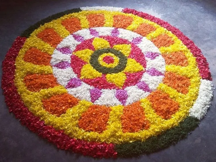 Circular Pookalam with petal layers and flower center image
