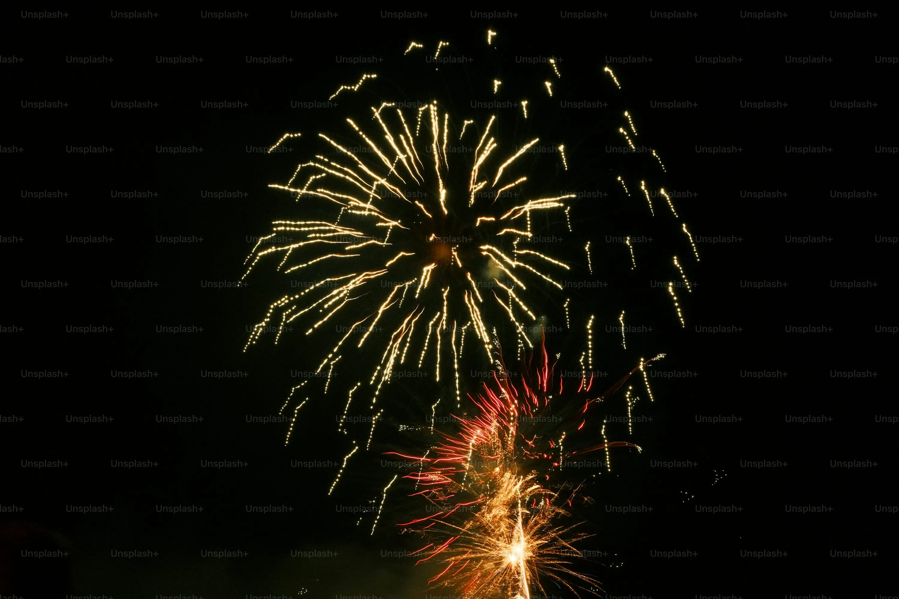 City Fireworks Display Lighting up a Clear Night Sky