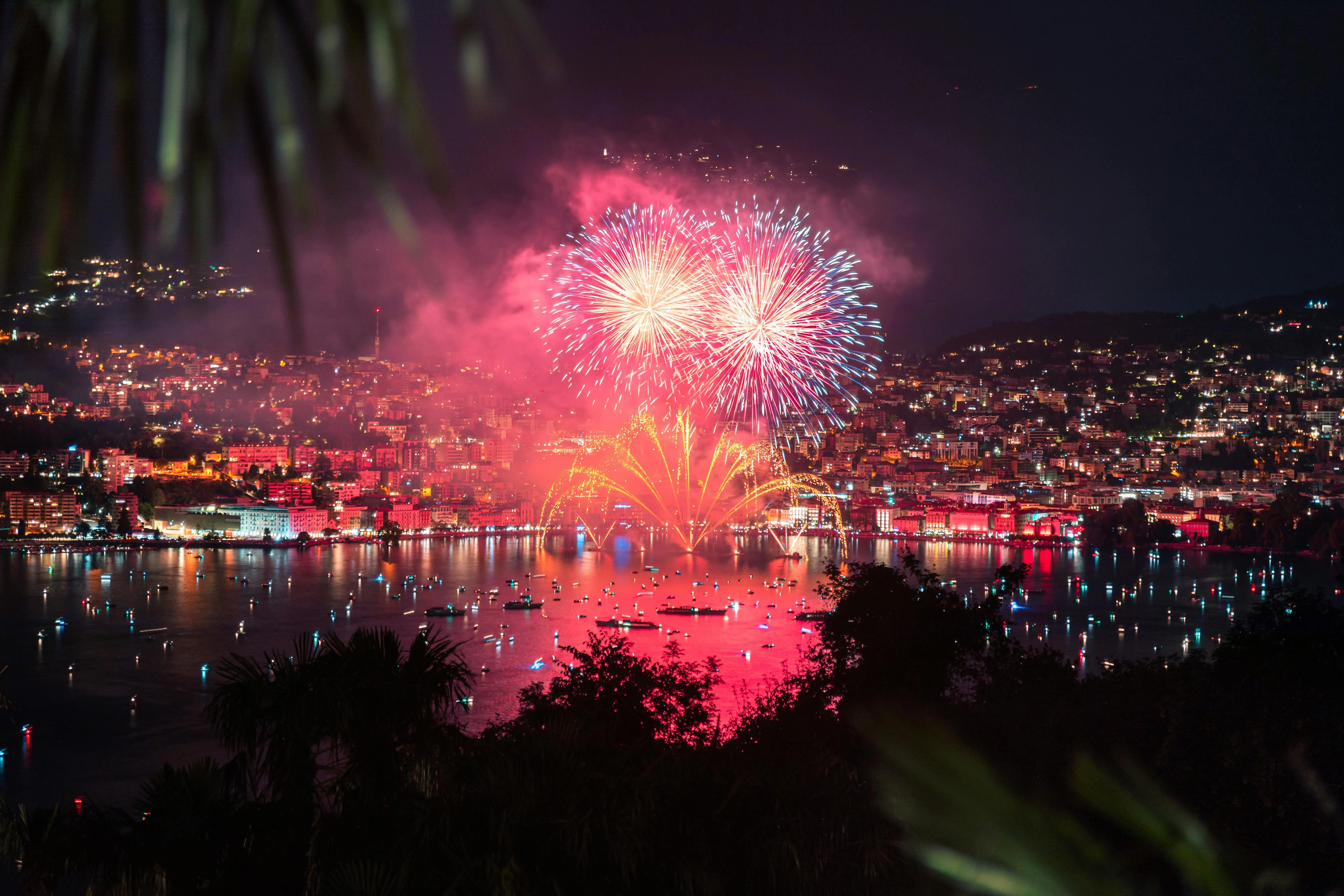 Cityscape Illuminated by Fireworks and Reflections