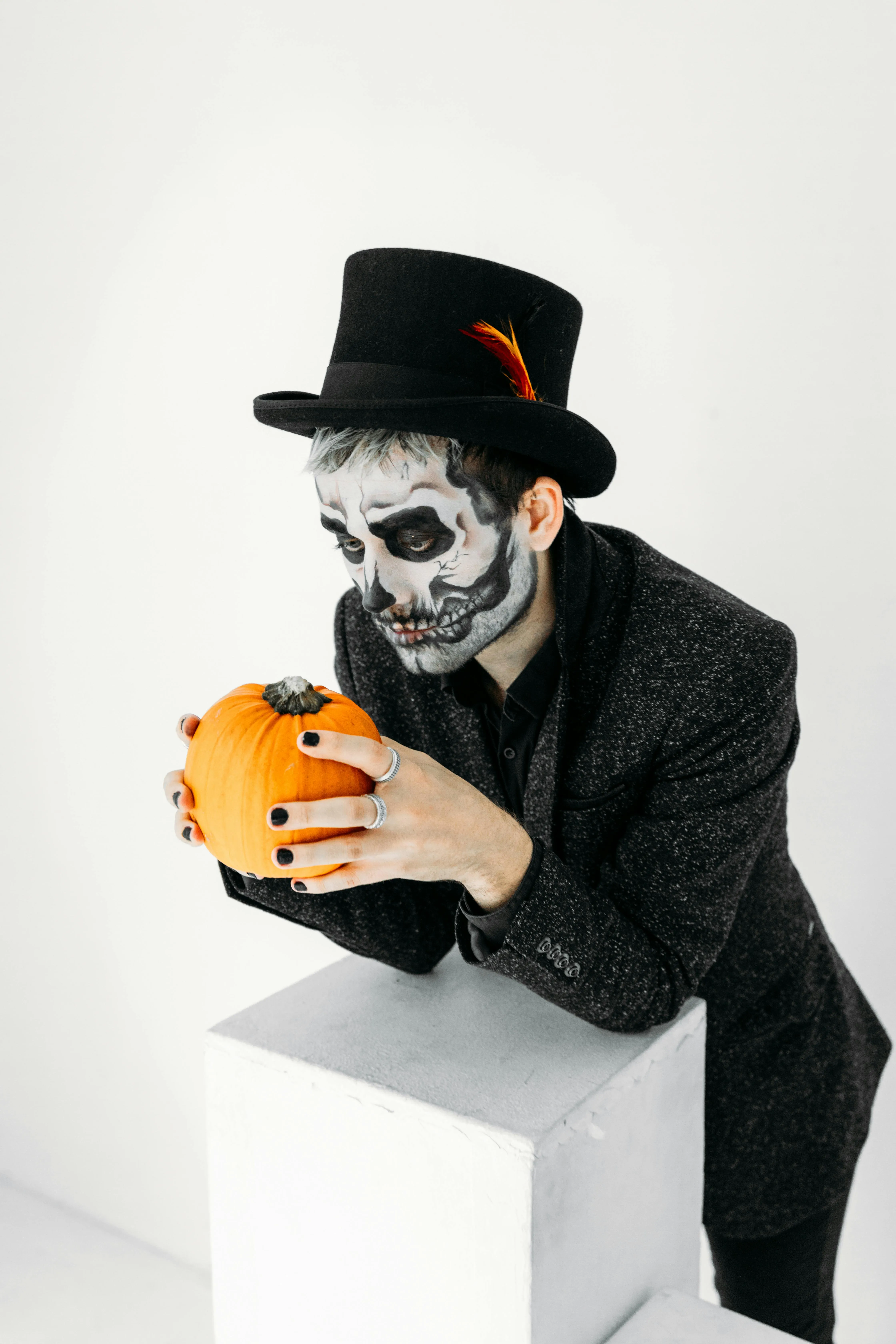 Classic Skeleton Costume Holding Pumpkin at Festival