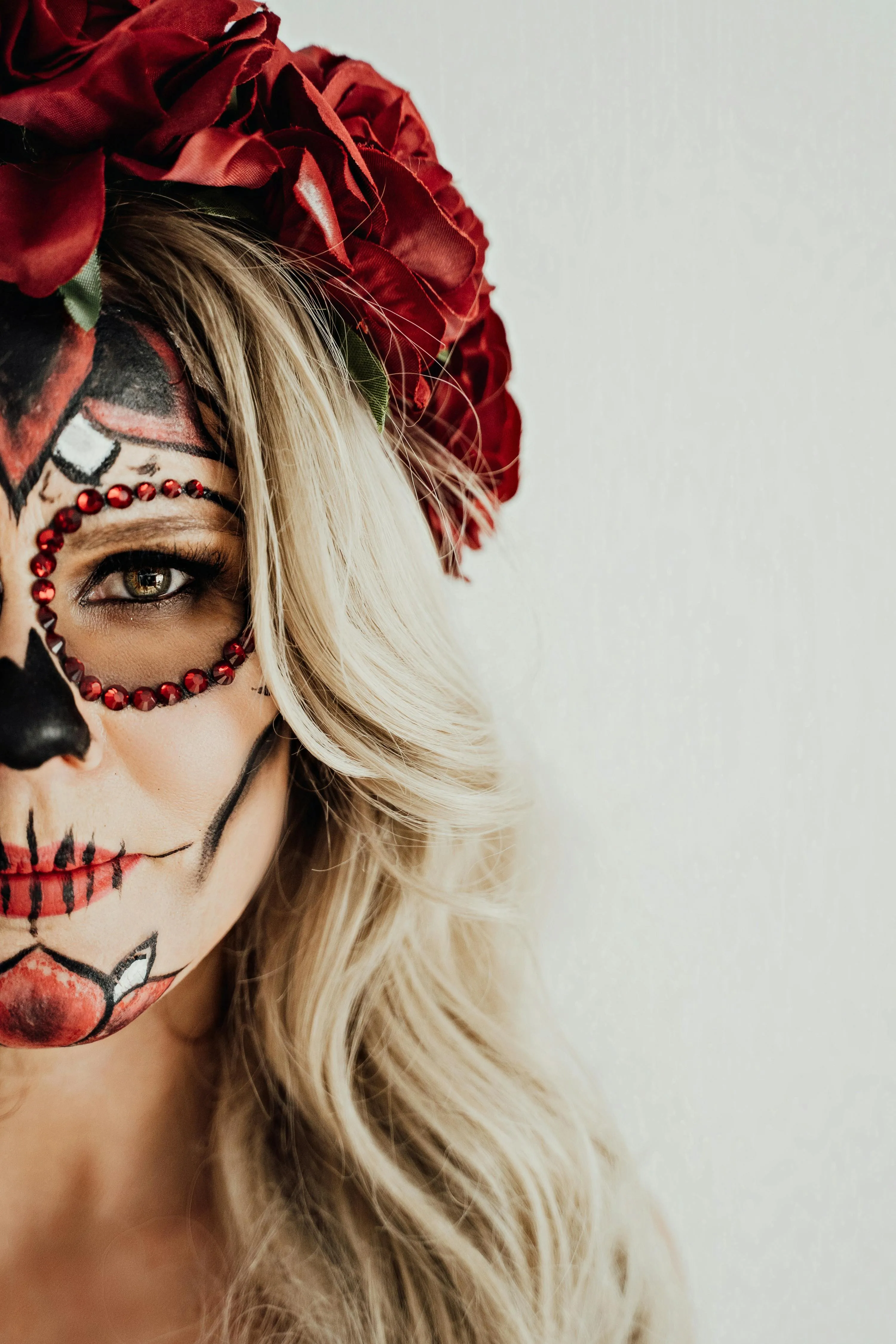 Close Up of Blonde Woman with Floral Skull Makeup Wallpaper