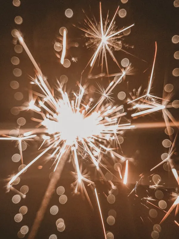 Close up of fireworks sparking brightly in the night
