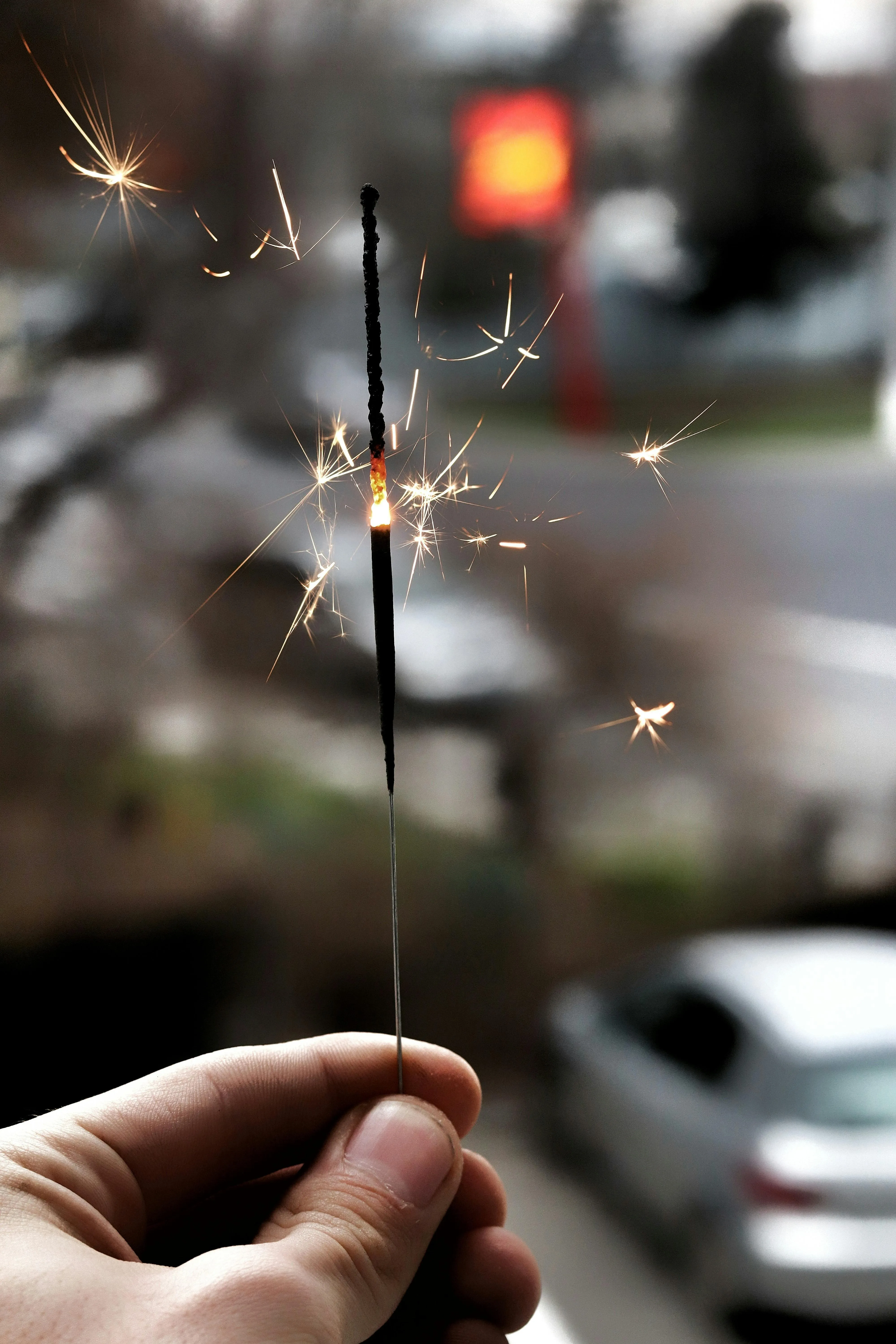 Close up of hands holding sparklers during a celebration HD