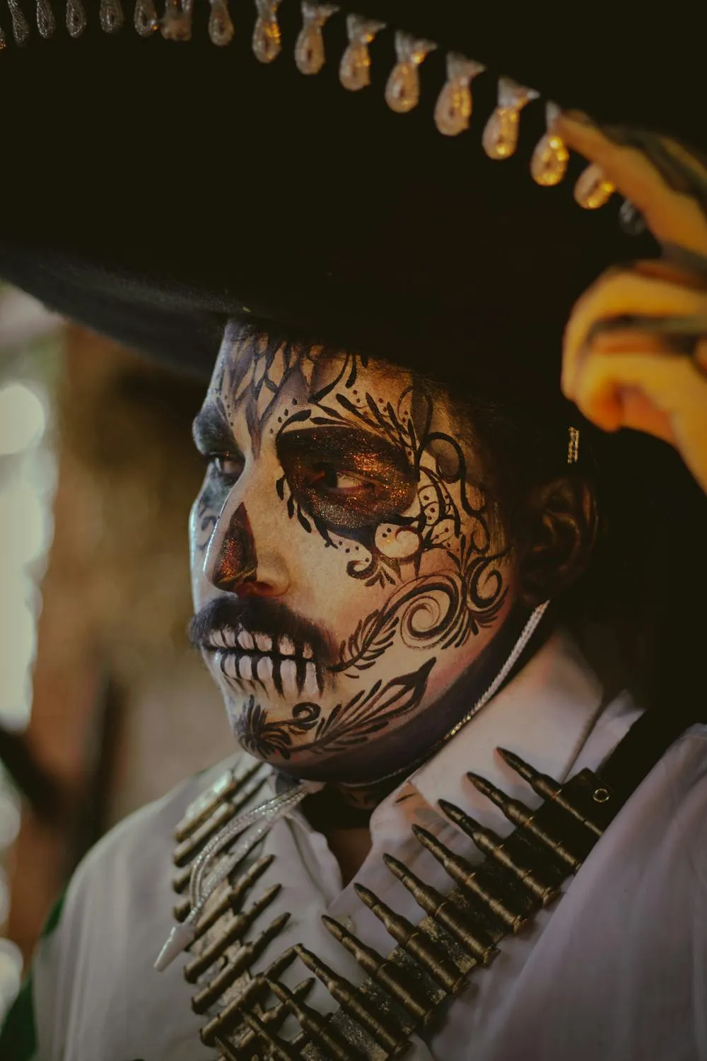 Close up of Man with Halloween Face Paint and Hat Wallpaper
