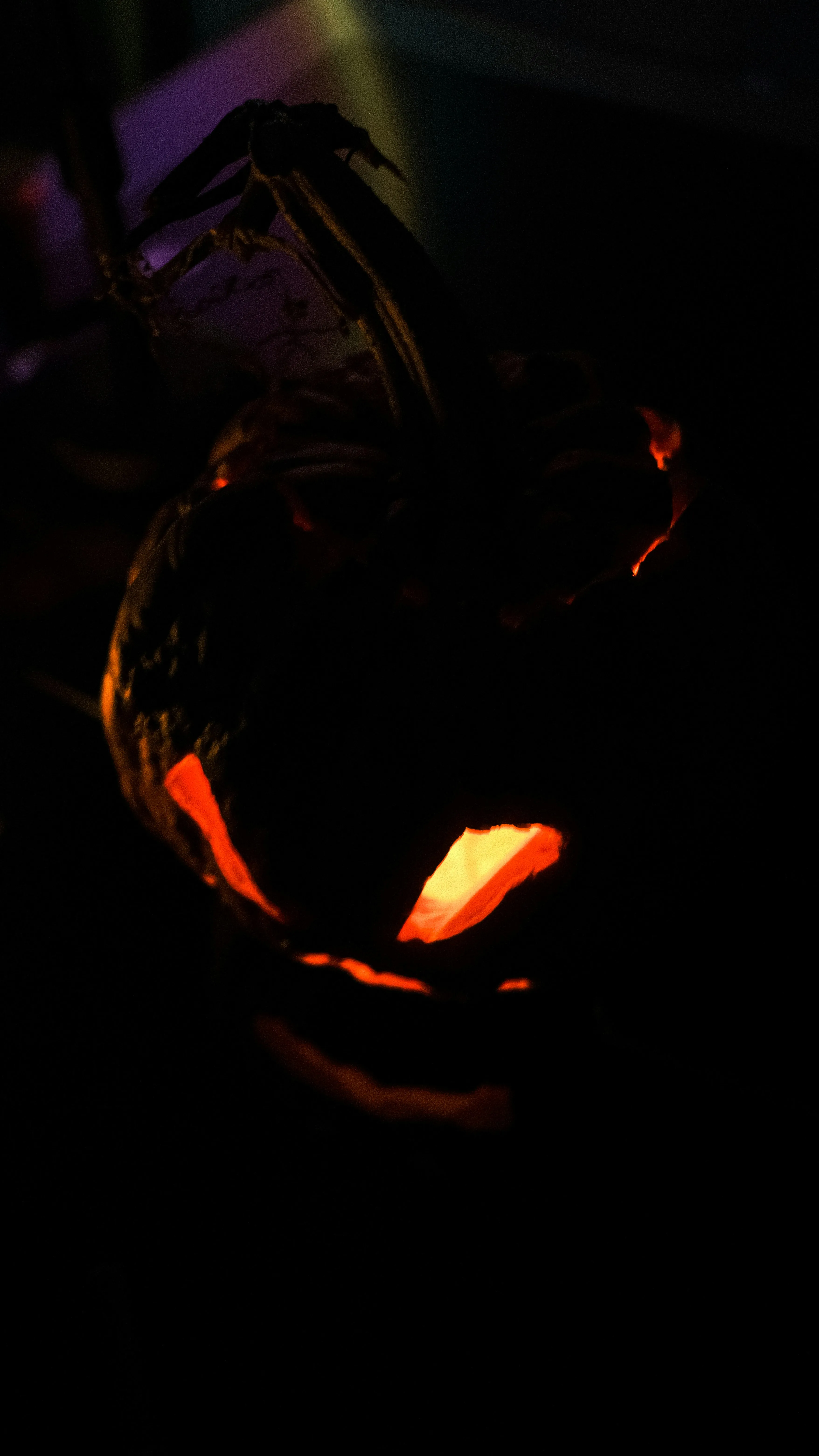 Close Up Of Scary Pumpkin Face Glowing in Dark Wallpaper