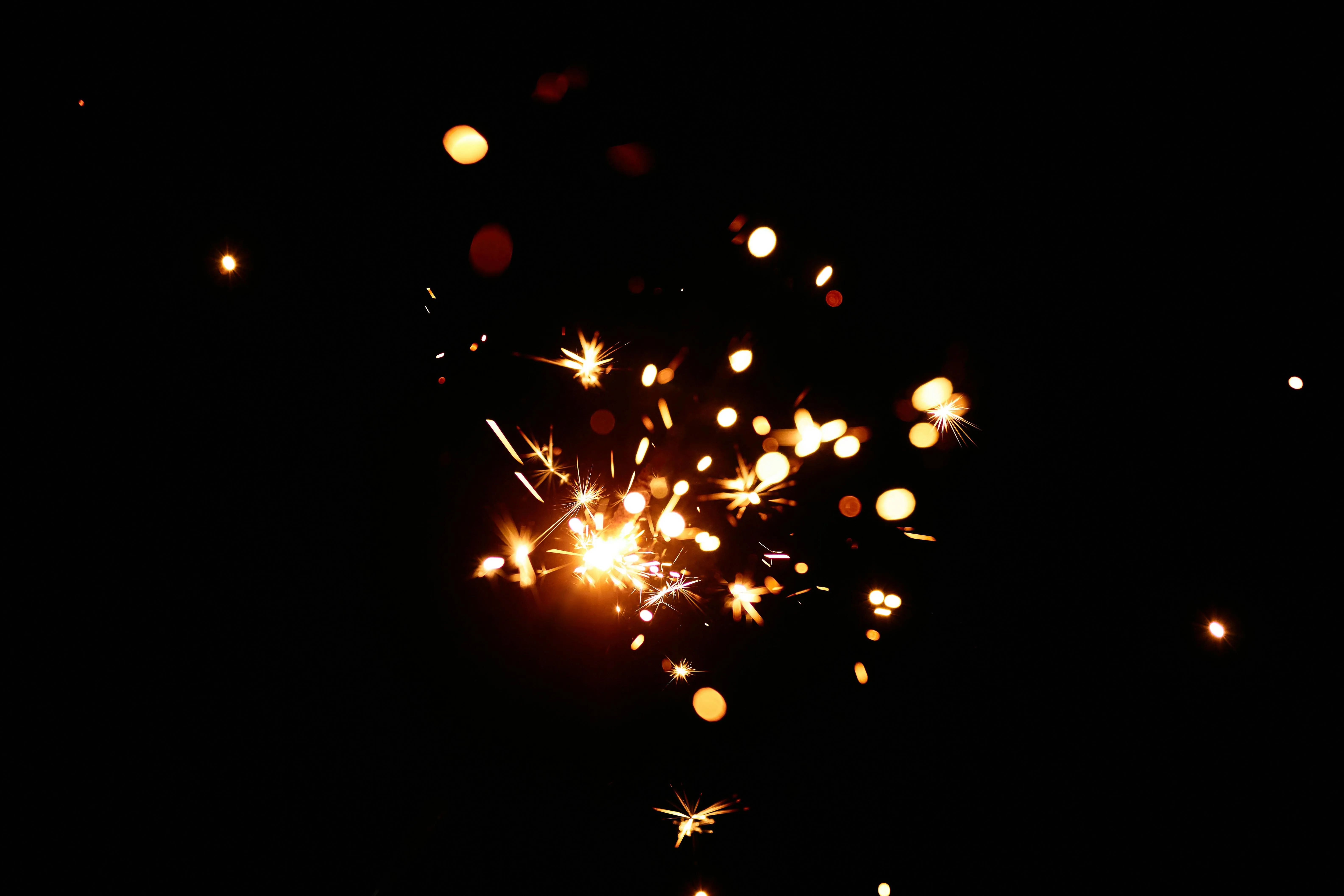Close up of Sparklers Creating Glowing Trails in the Dark