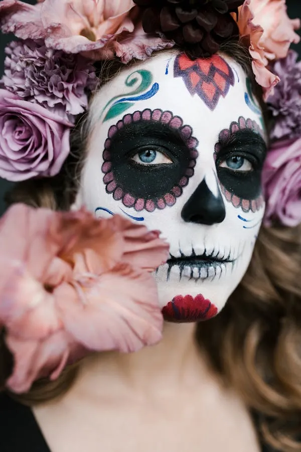 Closeup of painted face with floral crown and soft colors