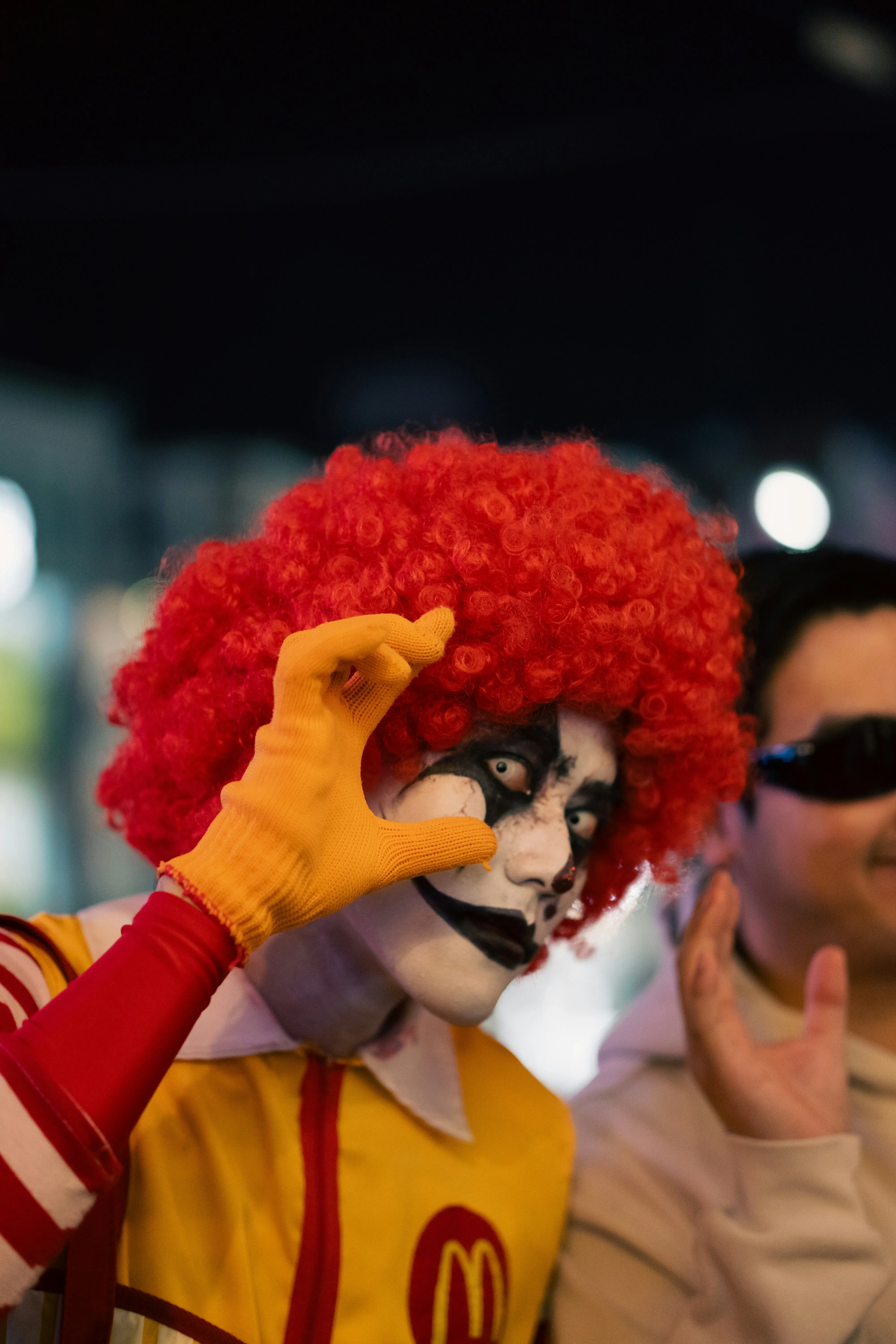 Clown and Masked Costume at Halloween Festival Wallpaper