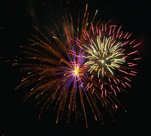 Colorful Firework Display over the City with Bold Hues