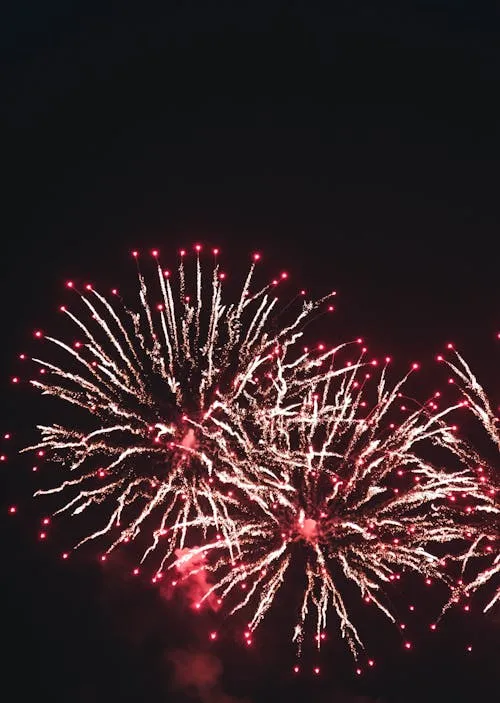 Colorful Firework Display with Red and Blue Sparks