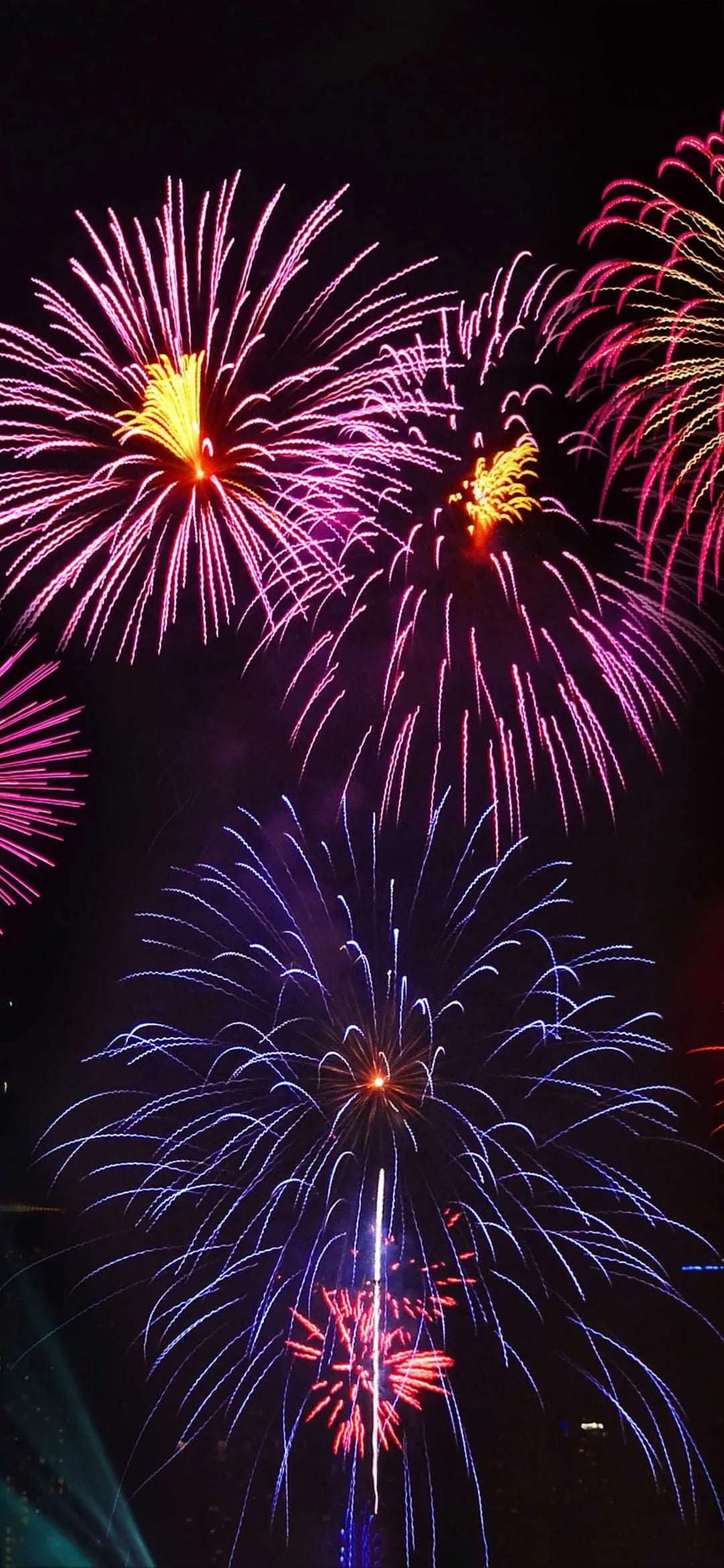 Colorful Fireworks Bursting over a Dark Horizon image