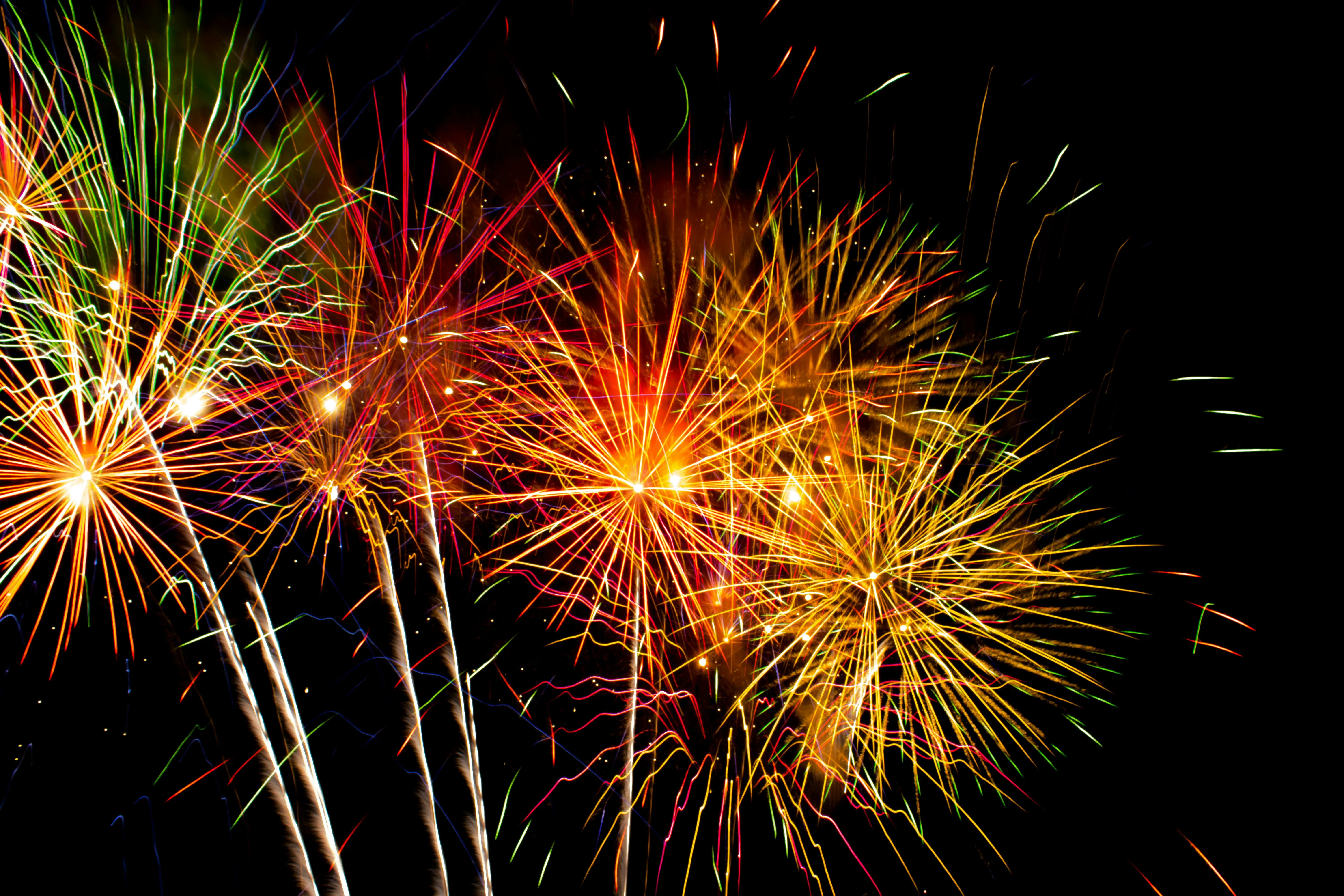 Colorful Fireworks Display Illuminating Night Sky Wallpaper