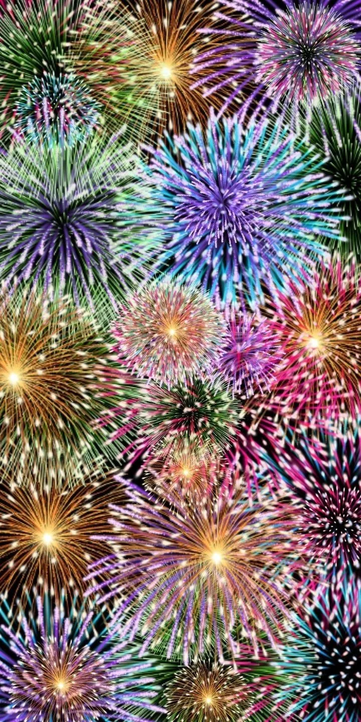 Colorful fireworks exploding in the night sky Wallpaper