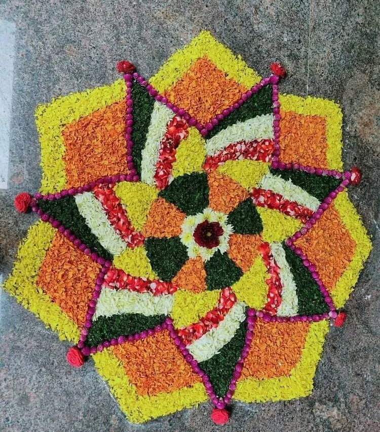 Colorful star shaped flower rangoli design for Onam festival