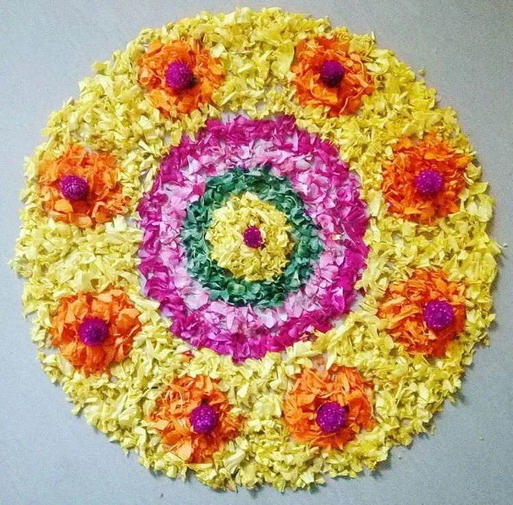 Colourful circular pookolam with purple details Wallpaper