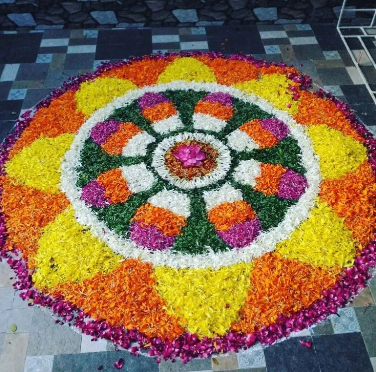 Colourful floral Athapookolam Design with purple circle