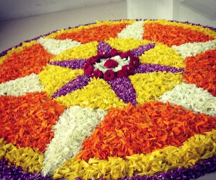 Colourful floral rangoli with star pattern design