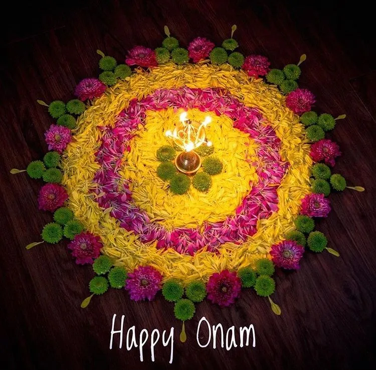 Colourful flower and petal rangoli with Happy Onam Text