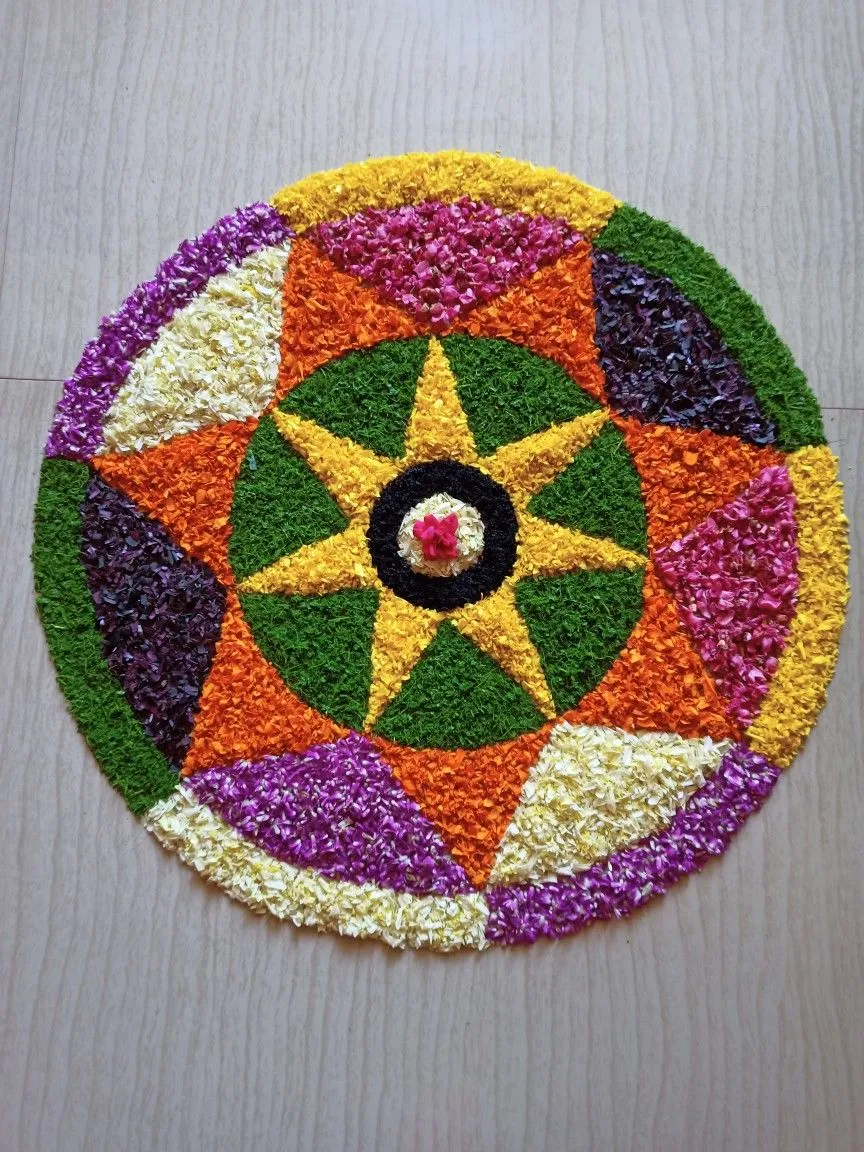Colourful Onam pookalam with Circular Floral Pattern