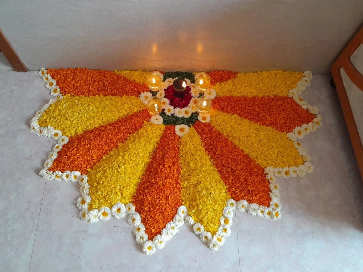 Corner Design rangoli with marigolds and lamps Wallpaper