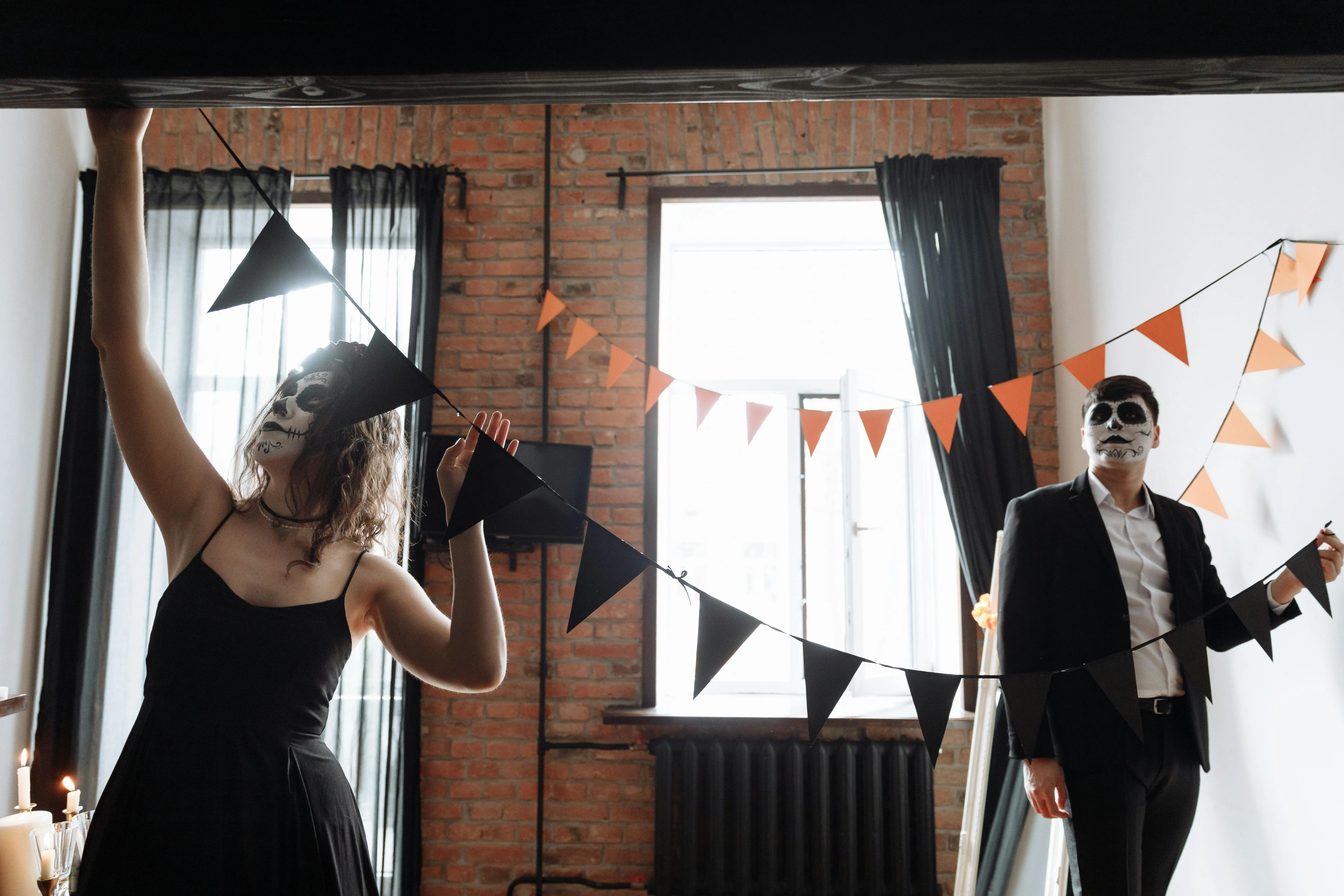 Couple arranging Halloween Party with Skeleton Costumes
