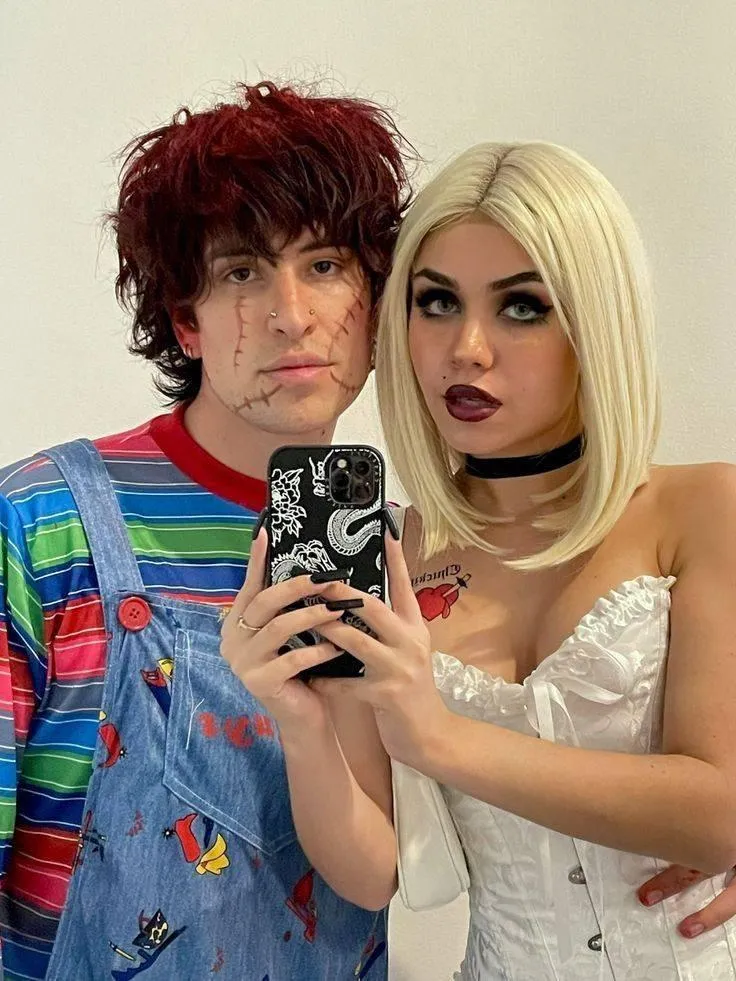 Couple Dressed as Classic Horror Characters Taking Selfie