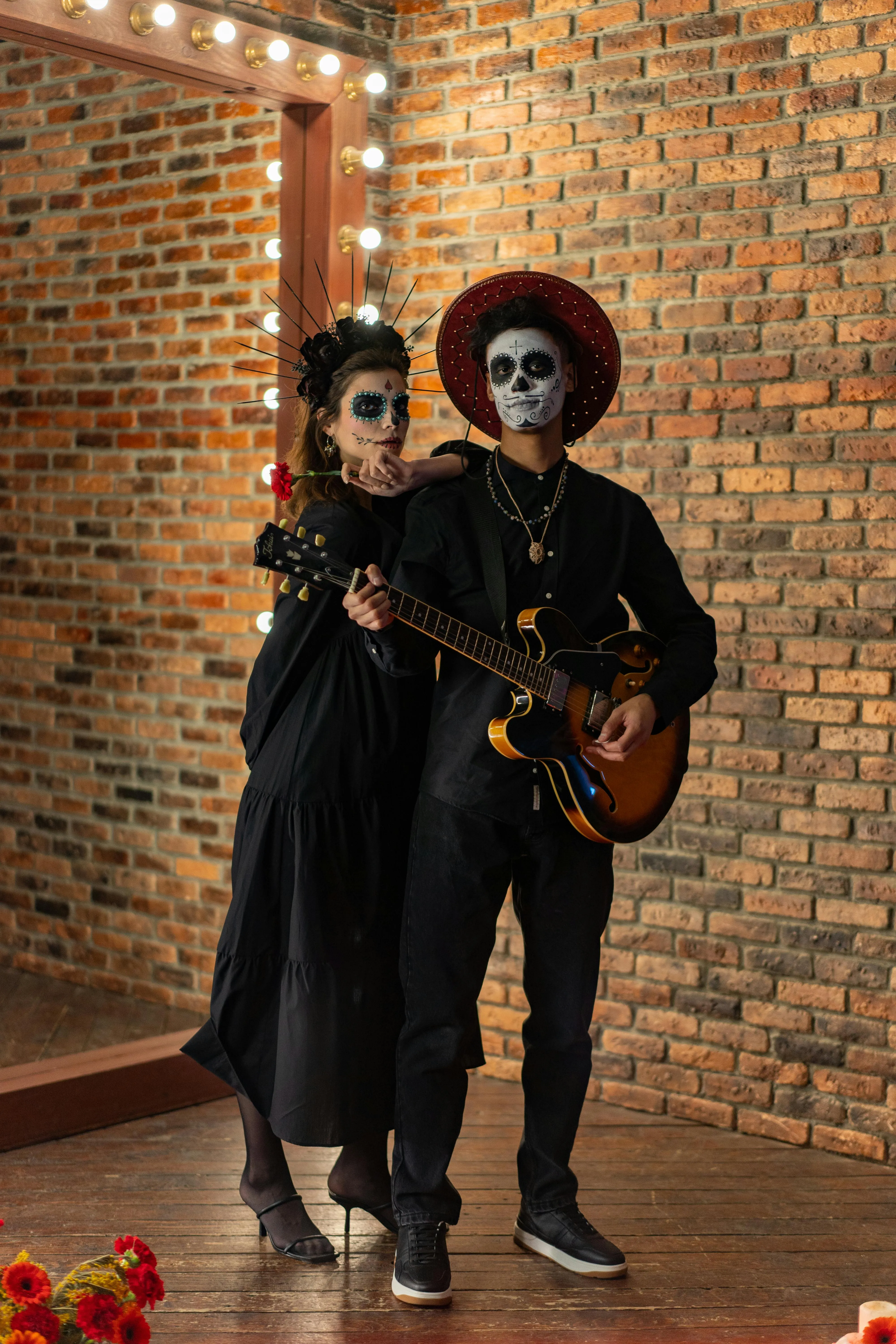 Couple in Costume Holding Guitar at Halloween Party