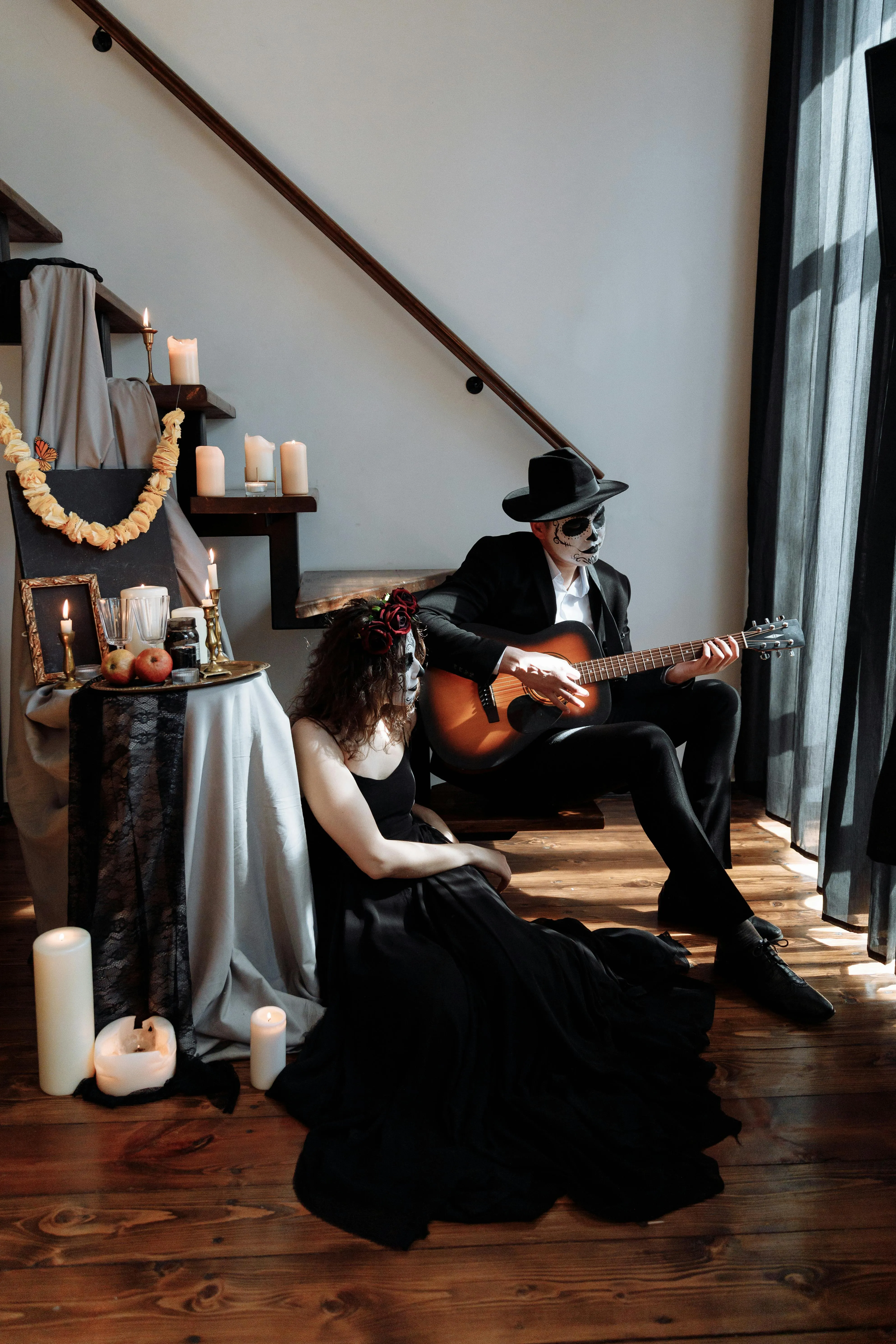 Couple in Gothic Costumes Playing Music Indoors Wallpaper