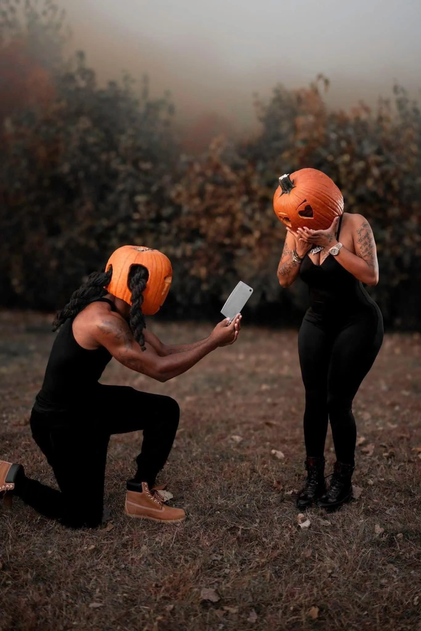 Couple Proposing in Pumpkin Head Costumes at Halloween