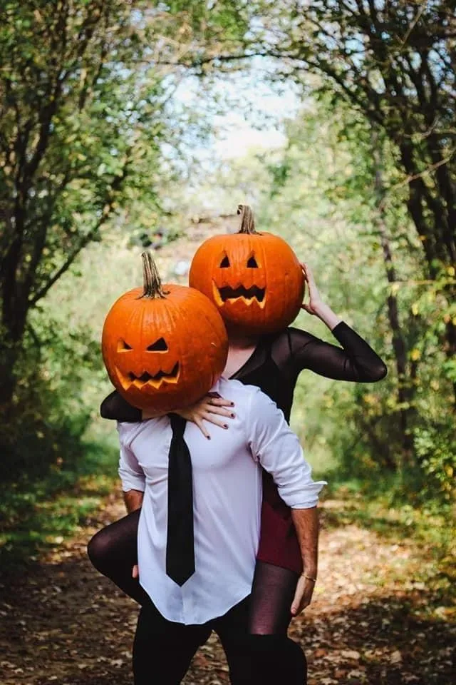 Couple Wearing Pumpkin Masks Outdoor Halloween Fun Image