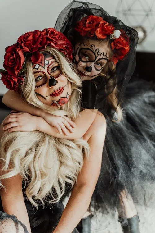 Couple with Red Roses and Gothic Makeup for Halloween
