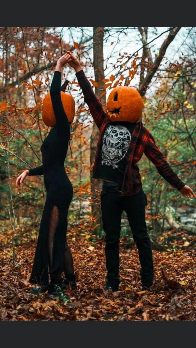Couples in Pumpkin costume dancing in the forest image