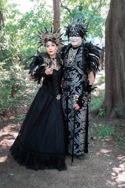 Couples in traditional black feather dress posing image